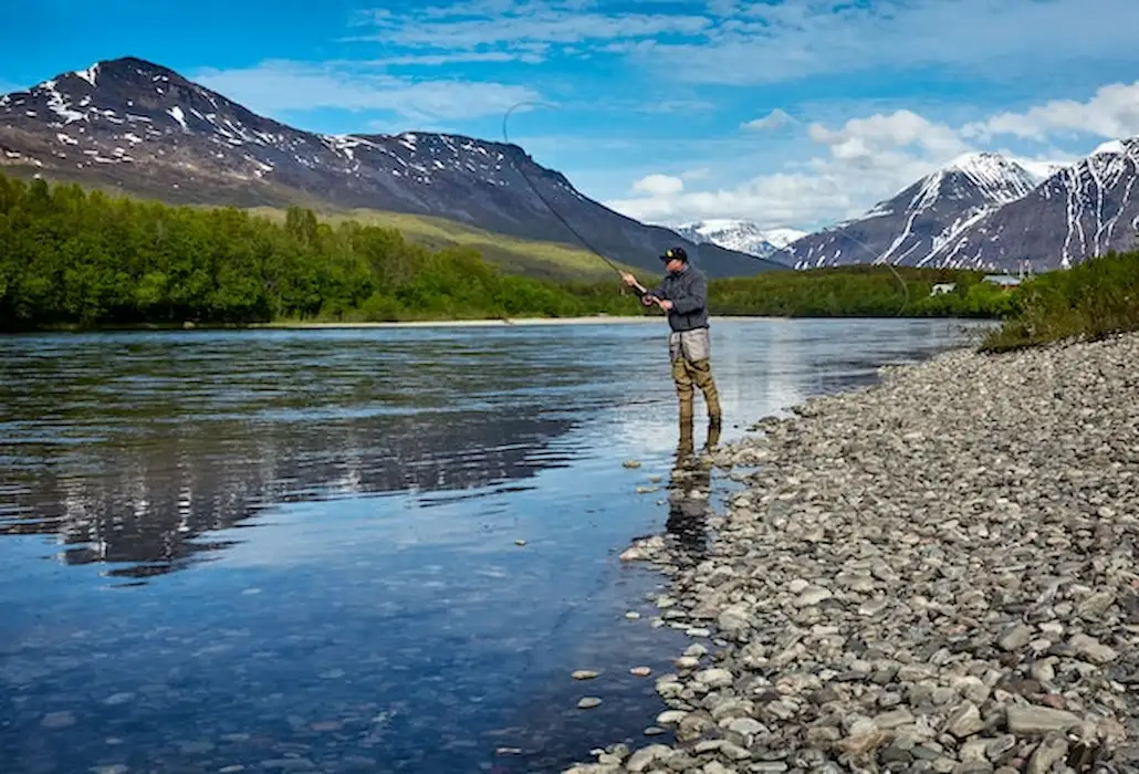 A man fishing at a lake